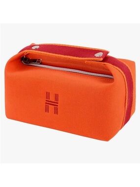 Orange Canvas Dopp Kit or makeup bag with an H on it